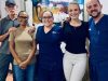 Dr. Josúe Chavés, Oral Surgeon and Vayolla Quíros, Office Manager with happy patients
