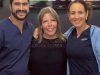 Dr. Andres Brenes, prothodontist and Dr. Karen Yurell, Patient Coordinator with a happy patient