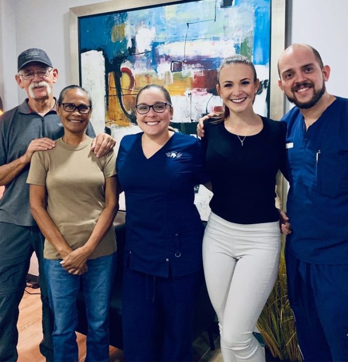 Dr. Josúe Chavés, Oral Surgeon and Vayolla Quíros, Office Manager with happy patients